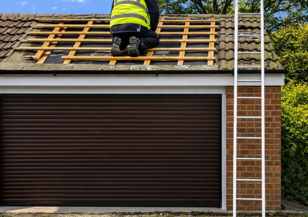 garage roof repairs pitched roofing roofer on a ladder