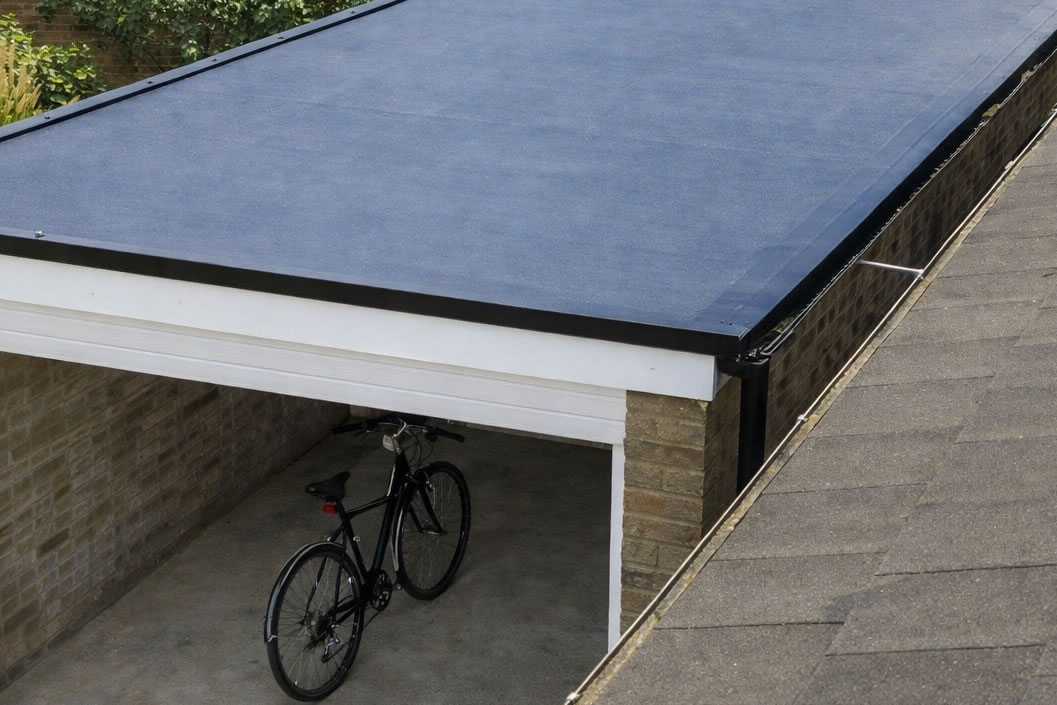 garage with a flat roof and bike inside